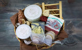 Gift Basket with natural shea butter soap, solid perfume, lip balm, body butter, facial mask, and wooden soap holder, in a beautiful handmade basket. Monarchess Natural Luxuries skincare products. Monarchess, Amman, Jordan