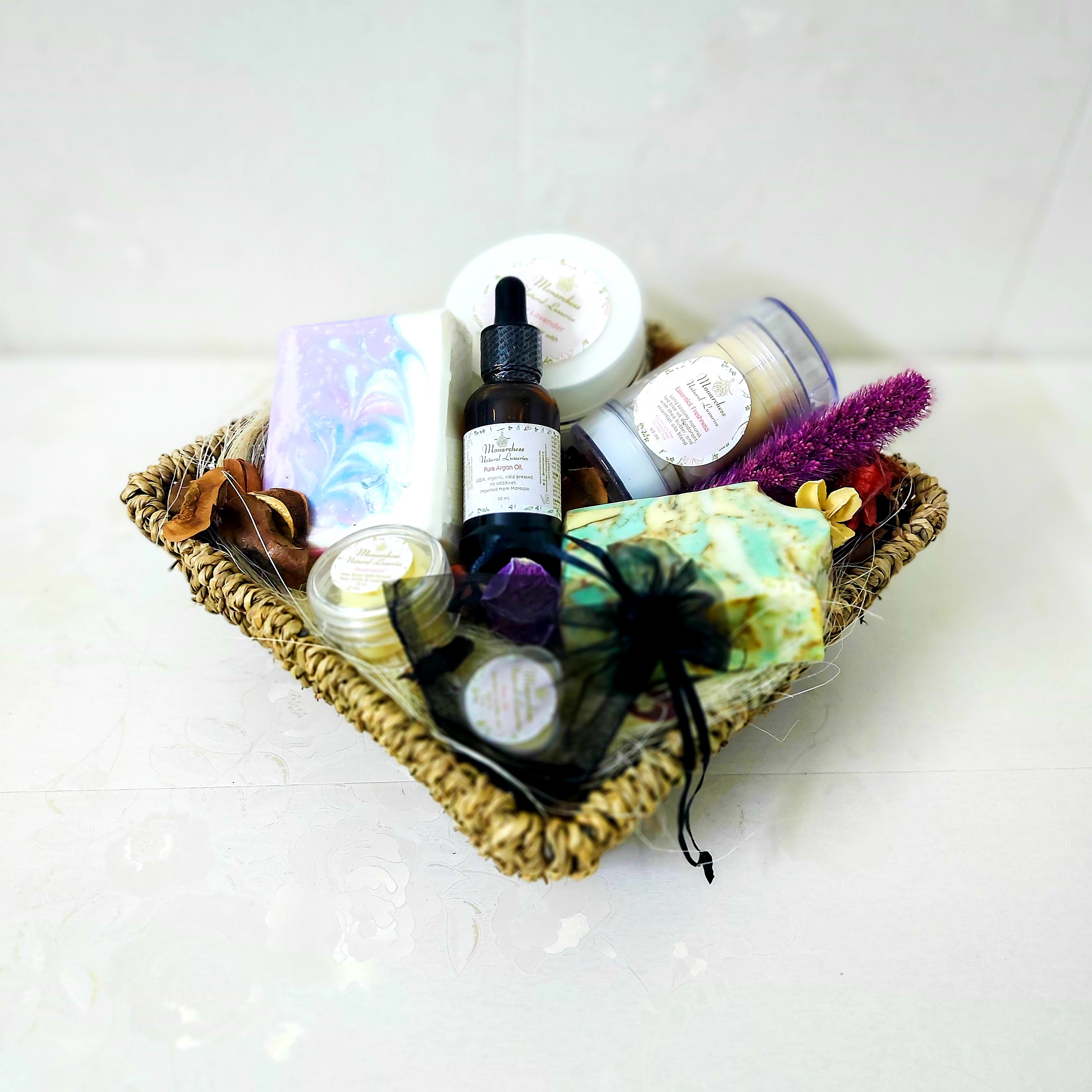 Gift basket contains lavender oil soap with shea butter, argan oil soap with shea butter, lavender body butter with shea butter, pure argan oil 30ml, Essential Freshness natural deodrant, solid perfume, lip balm. Monarchess, Amman, Jordan.
