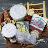 Gift Basket with two pieces of natural shea butter soap with different natural additives, solid perfume, lip balm, body butter, facial mask, and wooden soap holder, in a beautiful handmade basket. Monarchess Natural Luxuries skincare products. Monarchess, Amman, Jordan